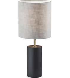 a black table lamp with a white shade on the top and a gold metal base