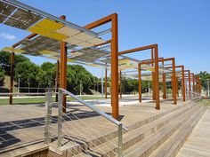 an outdoor area with wooden steps and metal railings