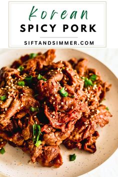 korean spicy pork on a white plate with text overlay