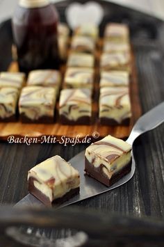 some brownies are sitting on a plate with a spoon