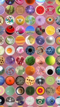 an array of different types of donuts on a pink background