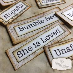 several wooden signs with words on them that say, bumble bee she is loved