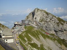 an aerial view of a building on top of a mountain