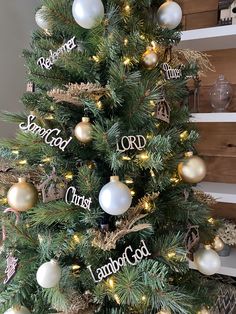 a christmas tree with ornaments and words on it