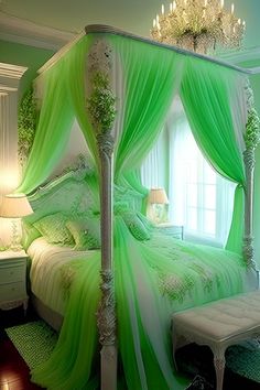 a bed with green sheets and curtains in a room