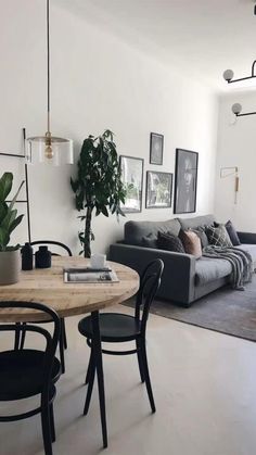 a living room filled with furniture and a wooden table