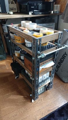 a kitchen cart filled with food on top of a hard wood floor