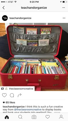 a red suitcase filled with lots of books