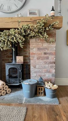 a living room with a fire place and various items on the floor next to it