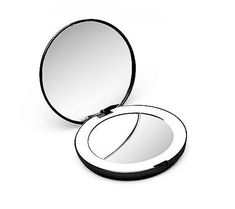 a compact mirror on a white background with no image in the top right hand corner