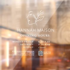 an advertisement for hannah mason's opening hours is seen through the glass door in this image