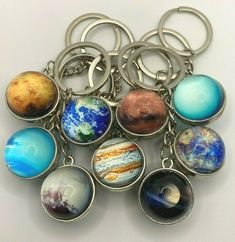 a bunch of key chains that have different planets on them