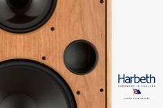 two speakers are shown side by side on a wood paneled surface with the words harbeth above them