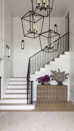 22 Best Neutral Paint Colors, According to Scouted Experts | The Scout Guide Chandelier In Stairwell, Foyer Paneling, 2 Story Entryway, Stairway Lighting Ideas, Staircase Lights, Stairway Ideas, Staircase Lighting Ideas, Entryway Stairs, Best Neutral Paint Colors