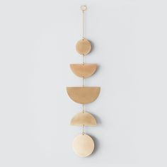 three wooden circles hanging on a wall