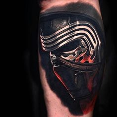 a man's arm with a star wars tattoo on it, and a darth vader mask