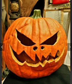 a carved pumpkin sitting on top of a table