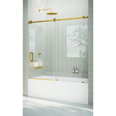 a bathroom with a bathtub, shower head and two gold fixtures on the wall