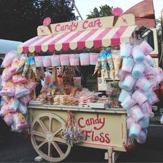 an ice cream cart with candy on display