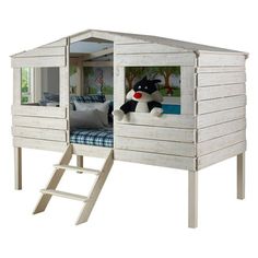 a wooden bunk bed with a stuffed animal in it