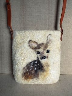 a small purse with a deer on it