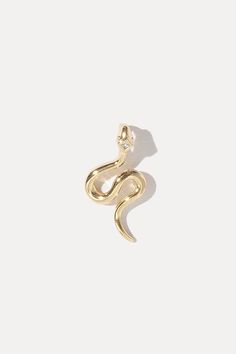 Add a little edge to your layer with the Snake Charm. Complete with a dainty CZ at the top, this piece won’t be overlooked. STYLING TIP: Add on to the Vera Chain and layer above the Alex Chain and Zodiac Charm. 18k gold-plated brass 19mm height 10mm width 1.25mm cubic zirconia Gold Snake Jewelry, Ss 2024, Snake Charmer, Outfit Styling, Snake Pendant, Snake Jewelry, Gold Snake, The Snake, Jewelry Inspo