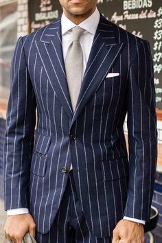 Navy blue and white pinstripe suit with silver grey tie. #bespoke #businessmensfashion #menwithstyle #tailored #mensguides #mensstyle #weddingideas #mensfashion #menswear #suits #menstyle #theclassypeople #gentlemen #groom #giorgentweddings Navy Pinstripe Suit, Terno Slim, Mens Fashion Blog, Suit Tie, Pinstripe Suit, Custom Suit, Suit Style, Fashion Suits