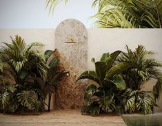 an outdoor shower surrounded by tropical plants next to a swimming pool with a clock on the wall