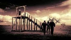 two men are walking up the stairs to an observation tower