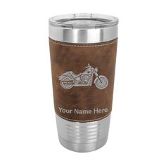 a stainless steel tumbler with a brown leather sleeve and the words your name here on it