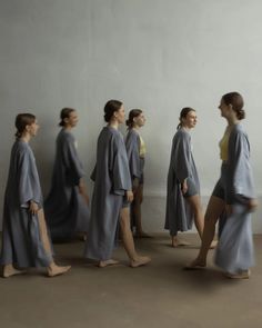 a group of women walking down a street