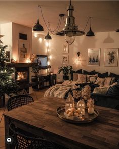 a living room filled with furniture and a christmas tree