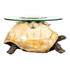 a turtle coffee table with a glass top