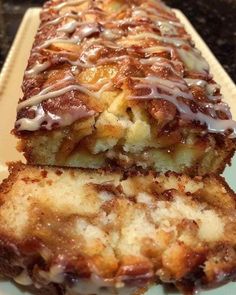 two pieces of cake sitting on top of a white plate with chocolate drizzle