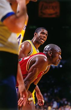 two basketball players standing next to each other