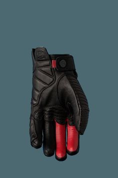 a pair of black and red gloves sitting on top of each other's fingers