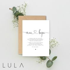 a card with the words in cursive writing on it next to some flowers