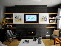 a living room filled with furniture and a flat screen tv mounted on the wall above a fire place