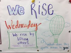 a sign that says we rise wednesday, we rise by lifting others