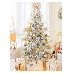 a white christmas tree with gold and silver decorations