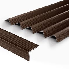 an image of some brown metal strips on a white background