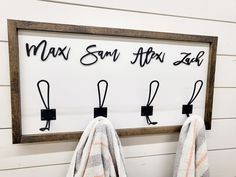 towels hanging on hooks in front of a sign that says max sam after zap