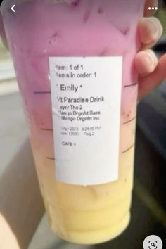 a person holding up a plastic cup filled with liquid and information on the label that says, team 1 of it's items in order