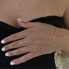 Dainty 18k gold plated/platinum plated hand chain. Our hand chain is so flattering and comfortable to wear. Our chain is sparkly and sits so beautifully on the hand. Layer with some of your favourite rings and bracelets. We have always been obsessed with hand chains so we created our own. Hand chains are so dainty and give that extra sparkle and shine to your hands. Measurements:  Bracelet - 6.5-7" inches (comes with extra adjustable 2" chain extender) Wrist to finger - 7 cm Please feel free to Permanent Hand Chain, Elegant Adjustable Chain Link Ring, Minimalist Delicate Chain Bracelet For Party, Minimalist Link Jewelry For Party, Dainty Metal Chain Ring, Bracelet With Ring Attached Hand Chain, Adjustable Dainty Chain Ring For Party, Dainty Adjustable Chain Ring For Party, Delicate Adjustable Gold Chain Ring