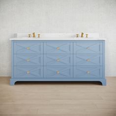 two sinks are on top of a blue cabinet