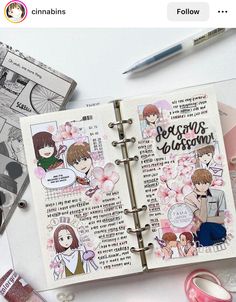 an open book with some stickers on it and other items around it, including pens