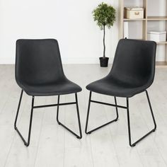 two black chairs sitting next to each other