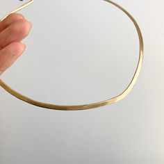 Estate/ vintage 14KT yellow gold neck wire/ collar necklace with one side matte finish, and other is hammered. Slight drip in front of the collar. Length: 16.5” Width: 3mm Weight: 28.5 grams Hook closure Solid/ stiff collar Excellent condition No longer stamped, but fully tested 14KT Elegant Hammered Choker Necklace, Modern Matte Gold Hammered Jewelry, Collar Necklace, Dip, Yellow Gold, Collar, Yellow, Gold