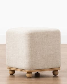 the foot stool is made out of wood and has wheels on each side that are attached to