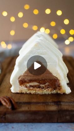 a piece of cake sitting on top of a wooden cutting board